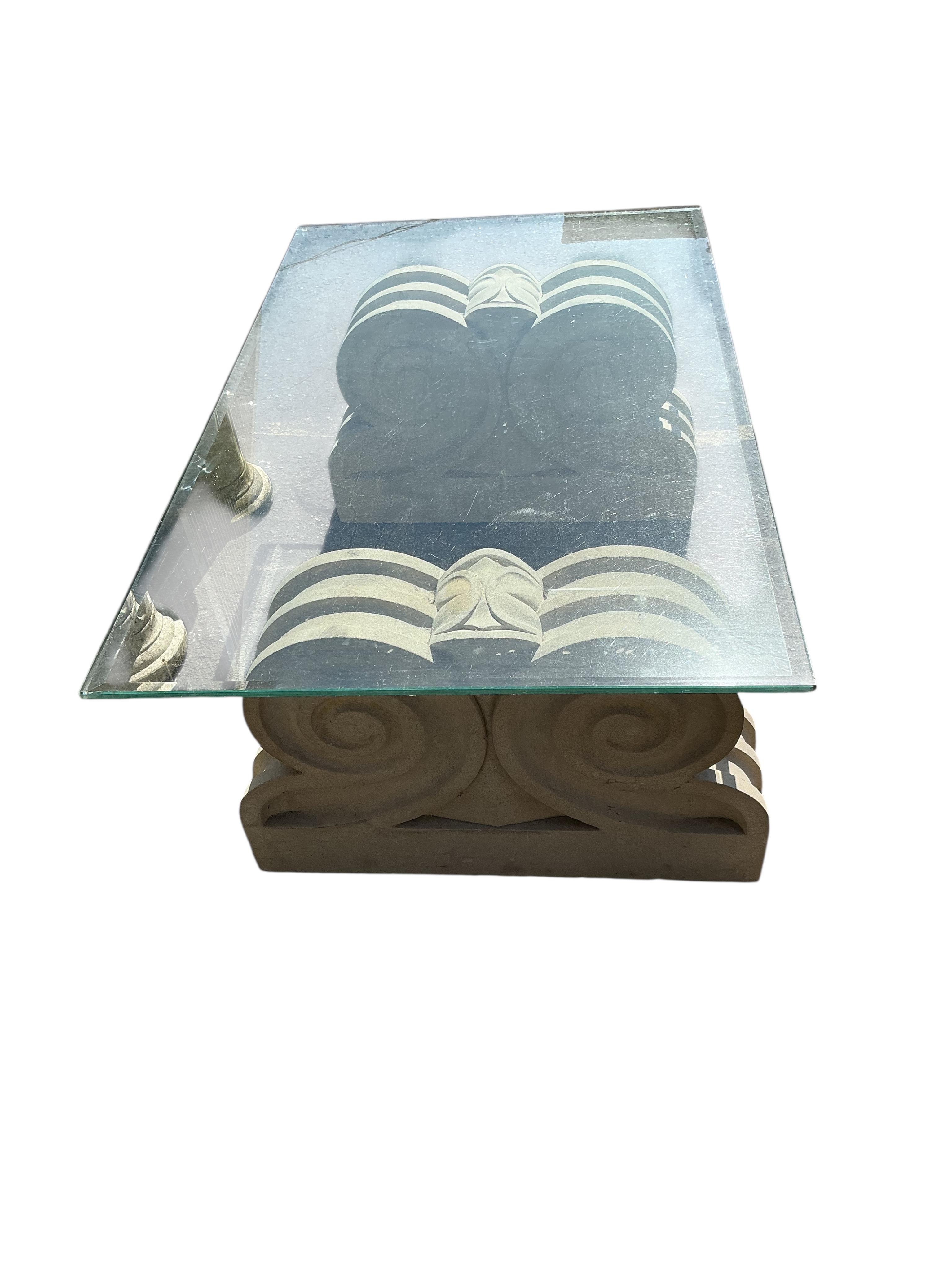 A reconstituted stone rectangular glass top garden table, width 117cm, depth 71cm, height 42cm